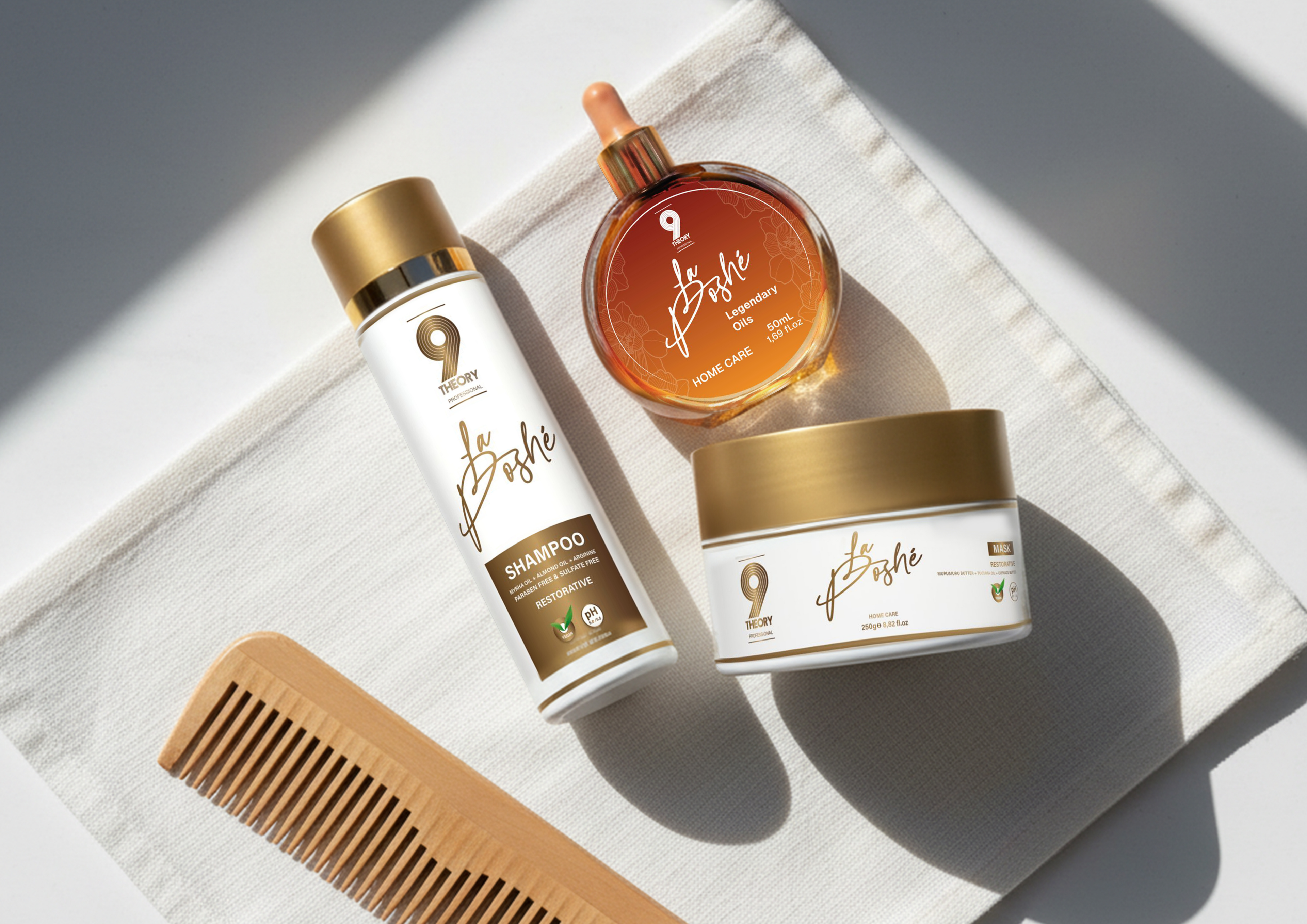 La Roche hair care products including shampoo, oil, and cream on a white surface with a wooden comb.